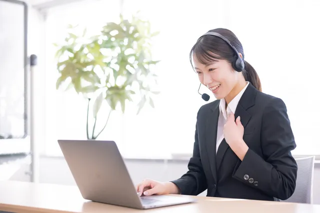 Staff member handling phone support with a headset